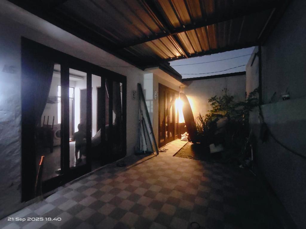 a hallway of a house with a ceiling at Ubung Little House Denpasar in Sempidi