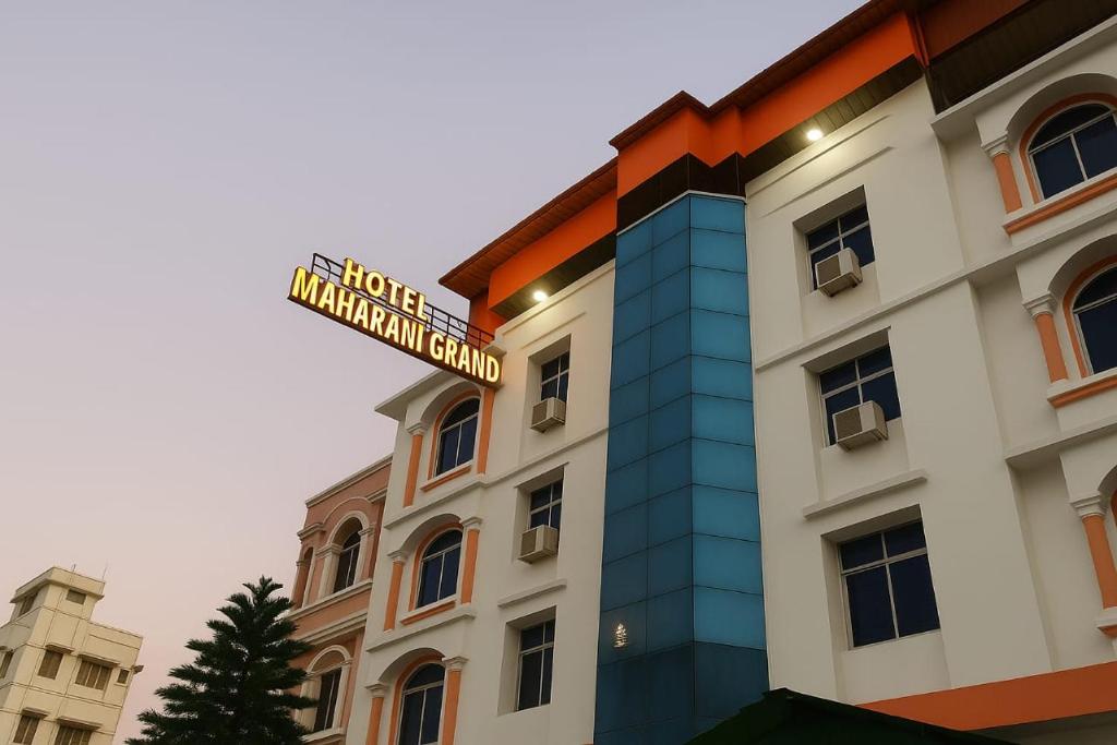 a building with a street sign on top of it at Hotel Maharani Grand Patna in Patna