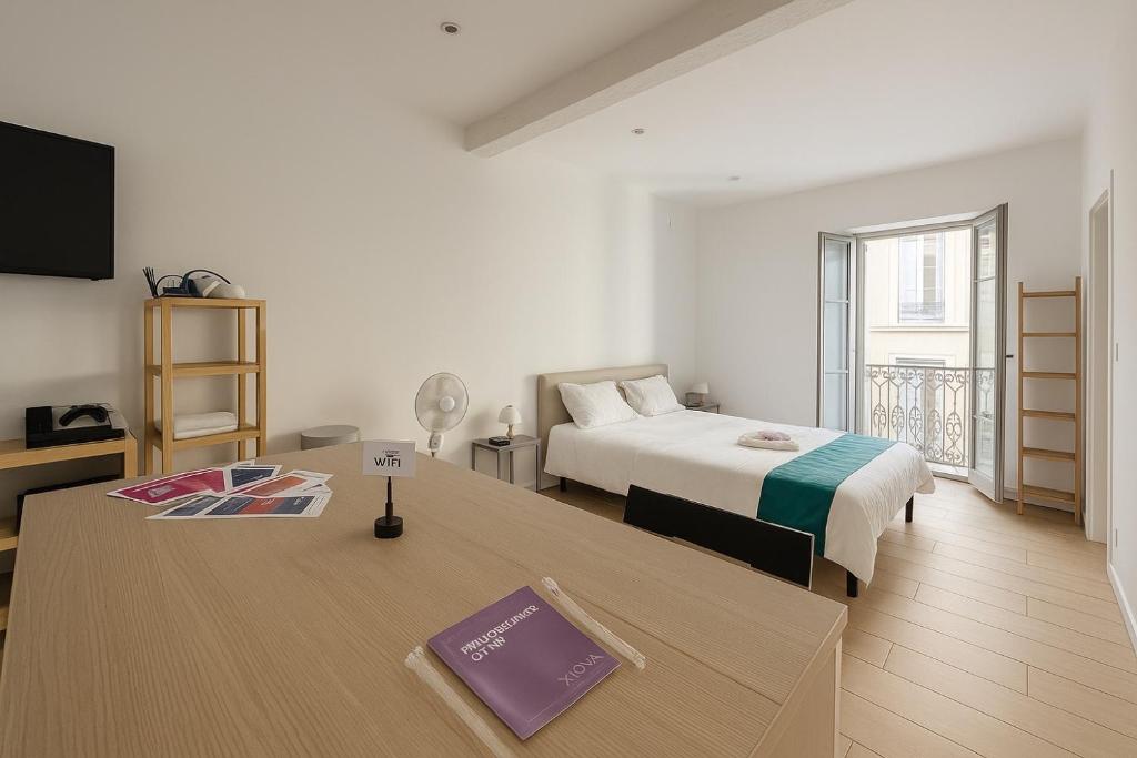 Postel nebo postele na pokoji v ubytování Appartement cosy coeur Montpellier