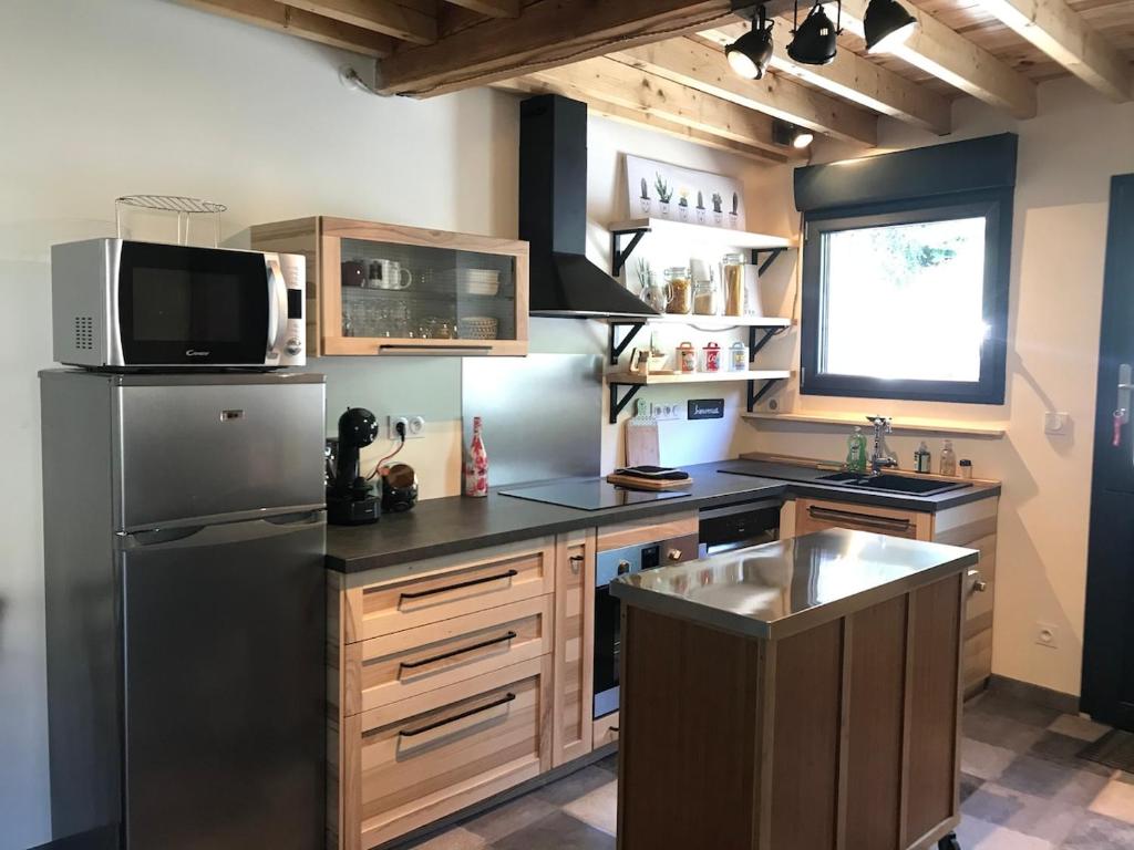 Cuisine ou kitchenette dans l'établissement La Grange