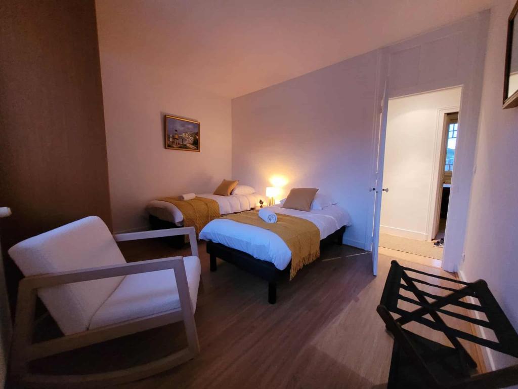 Ένα ή περισσότερα κρεβάτια σε δωμάτιο στο Le Repère du Large