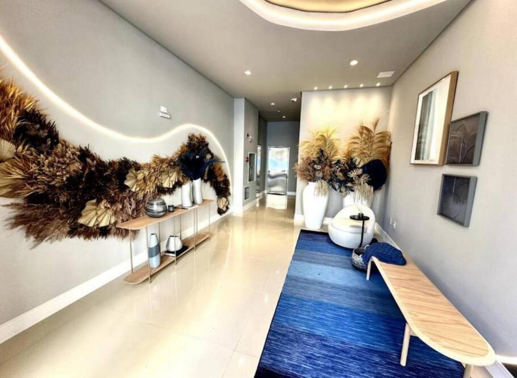 Μια τηλεόραση ή/και κέντρο ψυχαγωγίας στο Apartamento alto padrão de 2 quartos com Garagem