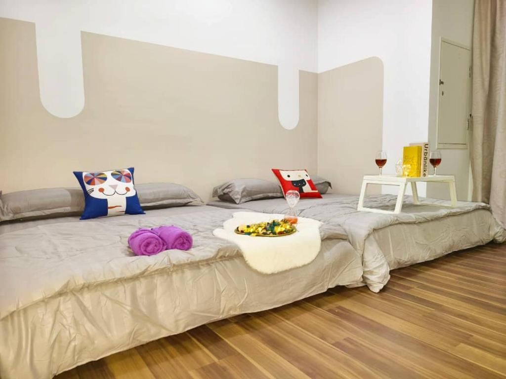 a large bed with a tray of food on top of it at SQ31 Sq where 55 inch 4 ktv sungai buloh in Shah Alam