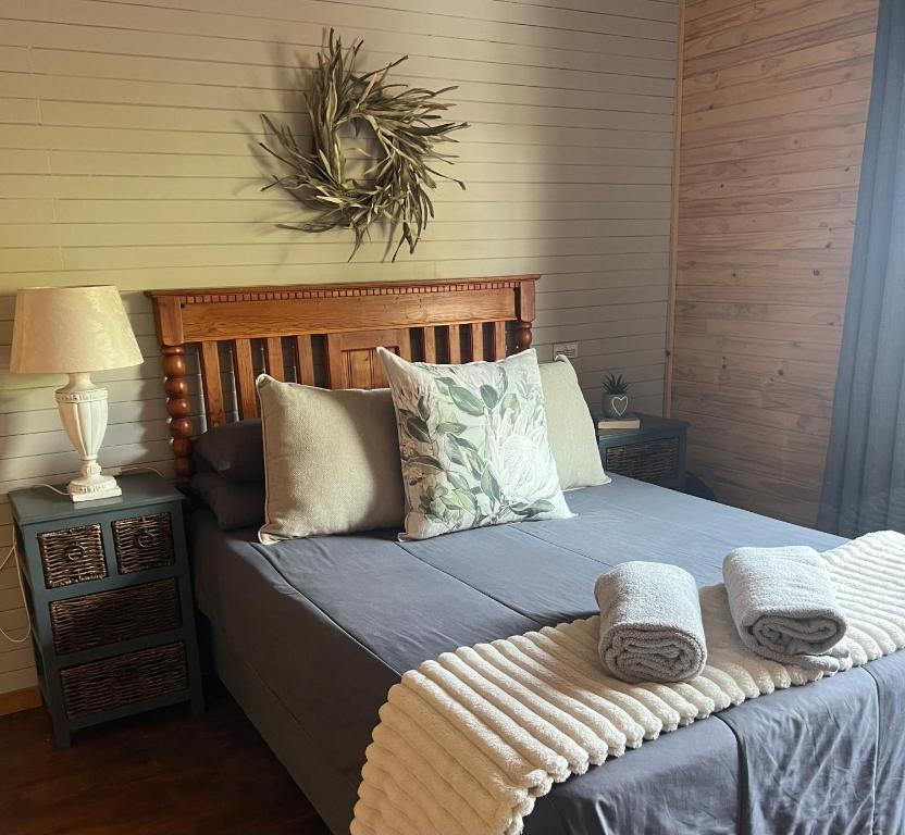 a bedroom with a bed with towels on it at Sonbesie in Marloth Park