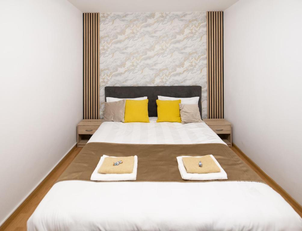 Ένα ή περισσότερα κρεβάτια σε δωμάτιο στο Sunrise Apartment
