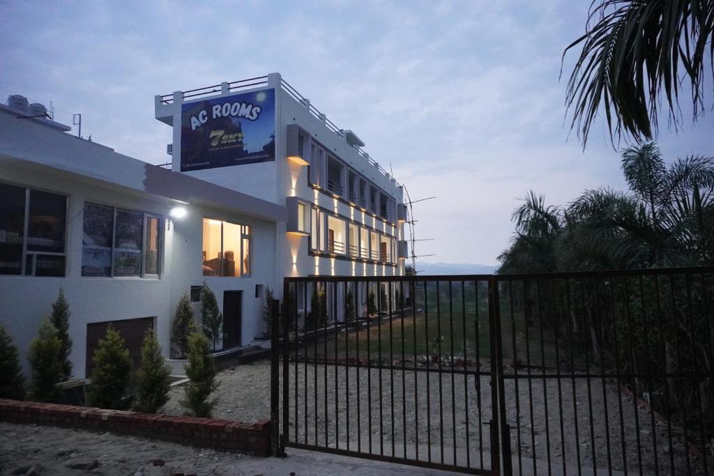 a building with a sign on the side of it at 7Sky Hotel and Restaurant in Bhojpur