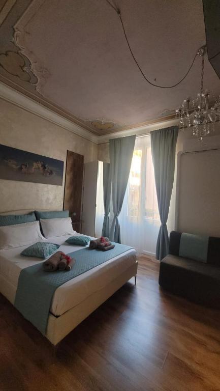 a bedroom with a bed with two people on it at Il TulipanoNero in Chiavari
