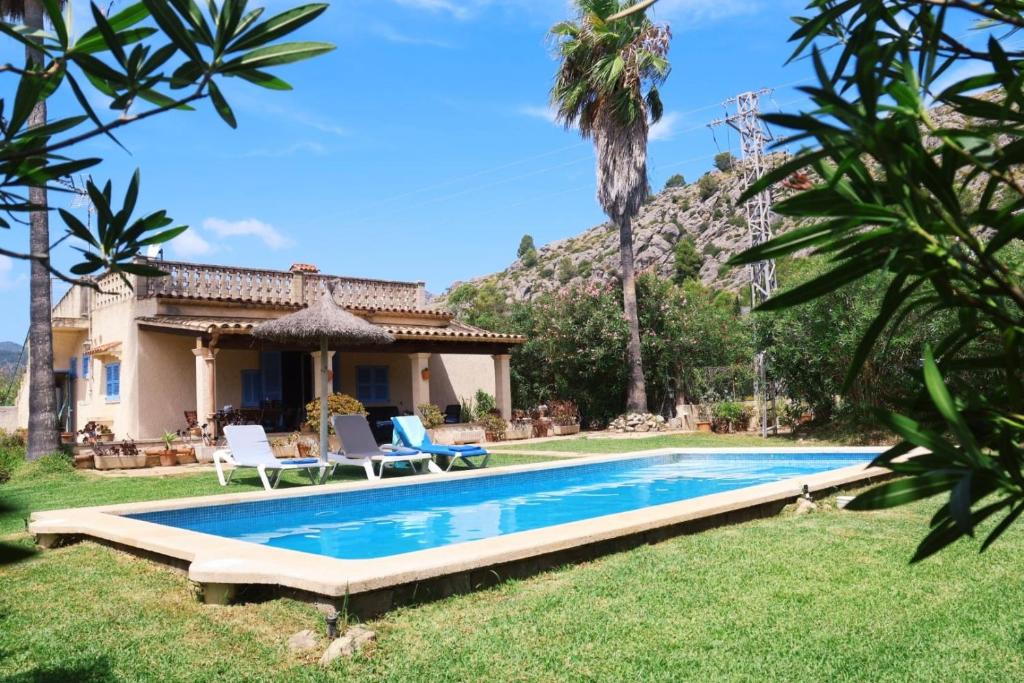 a pool in the yard of a villa at Villa Punta Magdalena in El Port