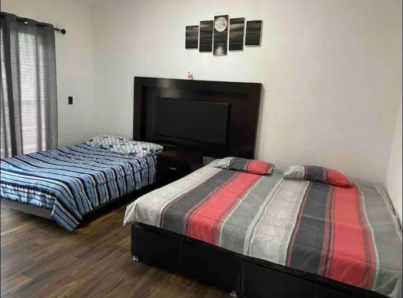 Ένα ή περισσότερα κρεβάτια σε δωμάτιο στο Casa Blanca