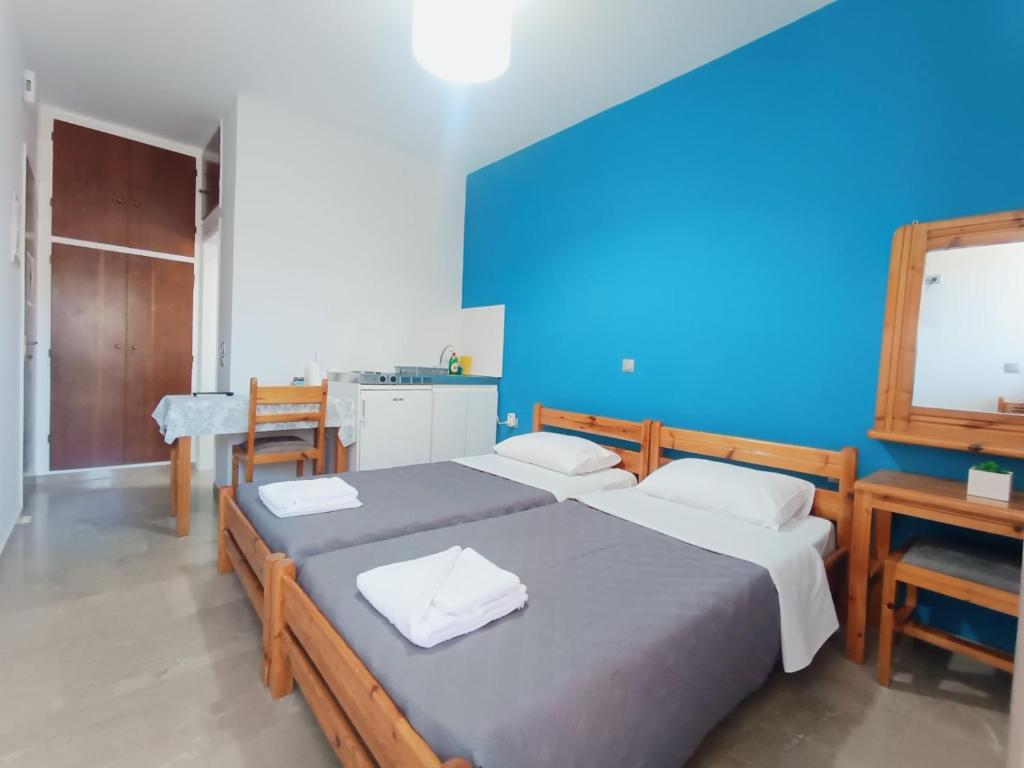 Postel nebo postele na pokoji v ubytování VASO'S APARTMENTS