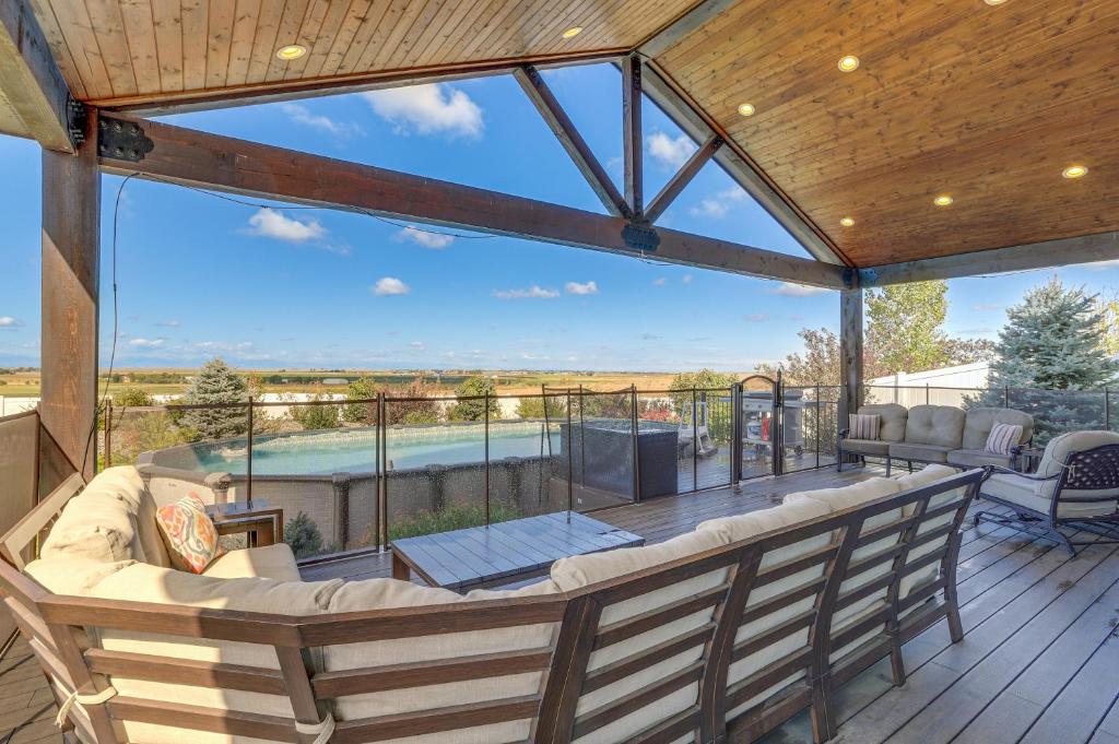 a screened in porch with a view of a pool at Private Hot Tub and Game Room Keenesburg Getaway! in Hudson