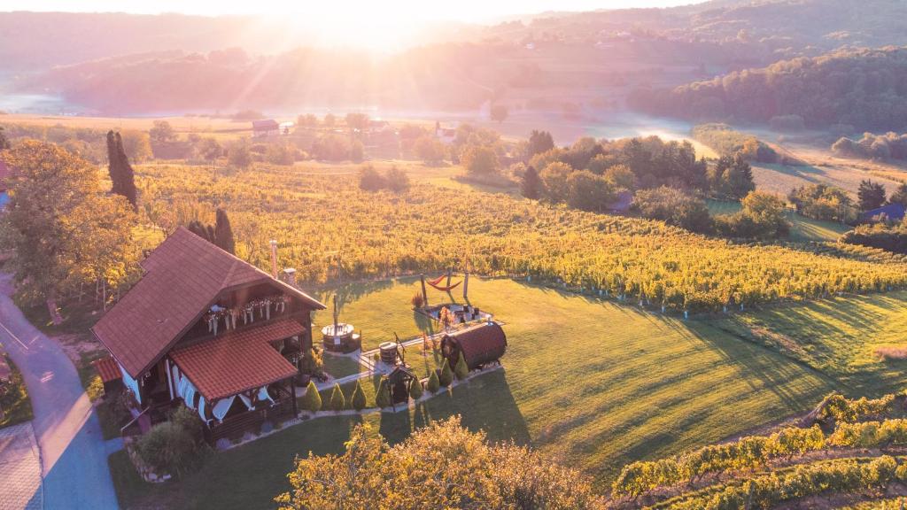 an aerial view of a farm with people on a train in a field at Holiday Home Hygge Nova in Grabrovnik