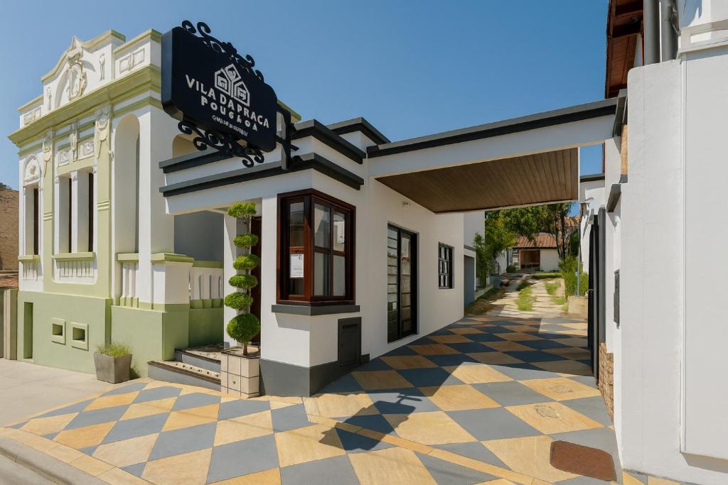 a rendering of the front of a building at Vila da Praça Pousada in Capitólio