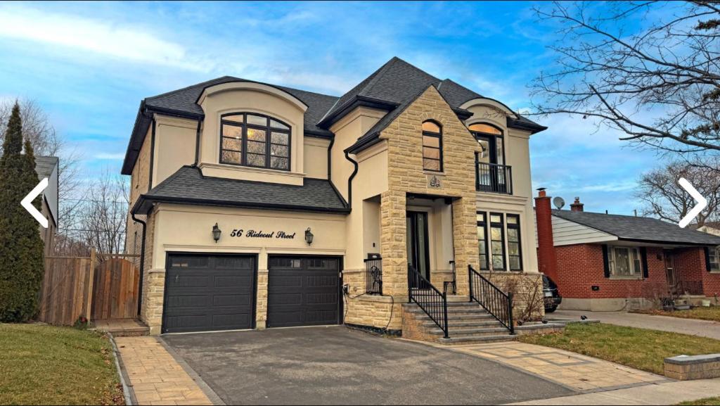 a house with a garage at Heaven on Earth in Ajax