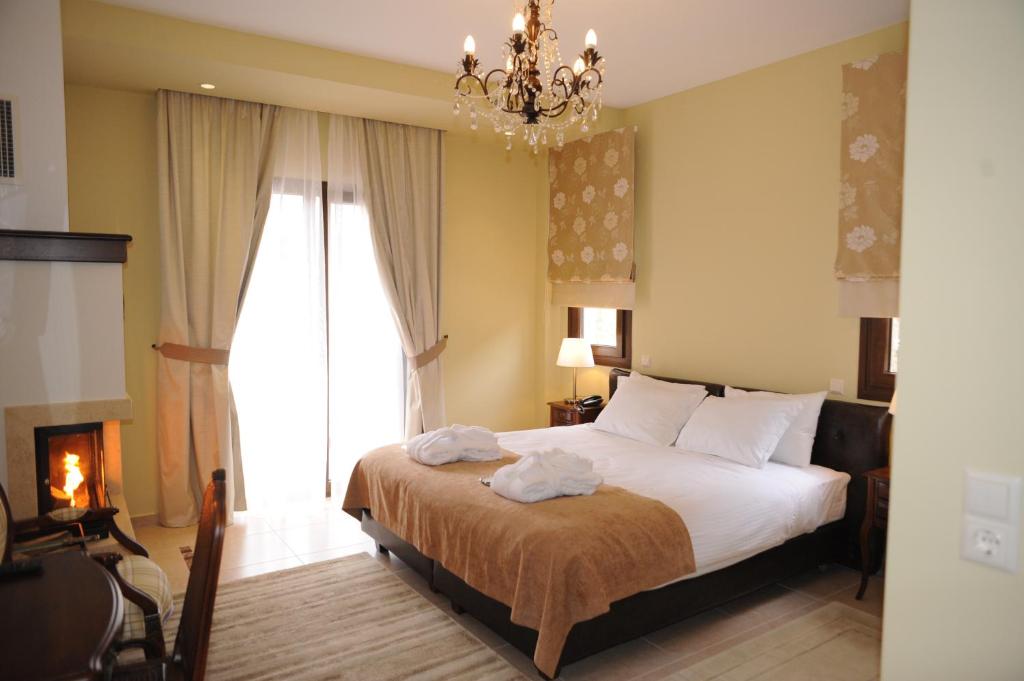 Postel nebo postele na pokoji v ubytování Agapi Luxury Hotel