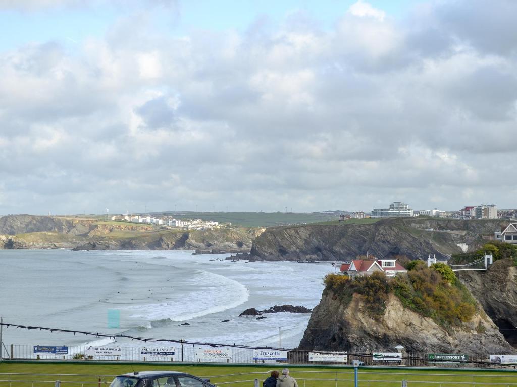 a view of a beach with the ocean and houses at Towan View in Newquay