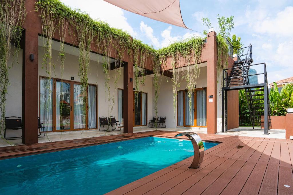 a villa with a swimming pool and a patio at Chrisenbel Hideaway Retreat in Petaling Jaya