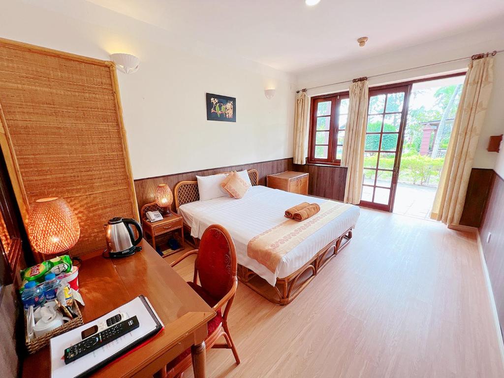 Giường trong phòng chung tại Little Muine Cottages Resort