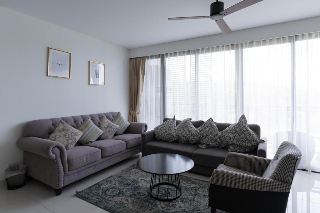 a living room with a couch and chairs and a table at Spacious 3BR Sea-View Condo Resort Amenities 2708 in Laguna Phuket