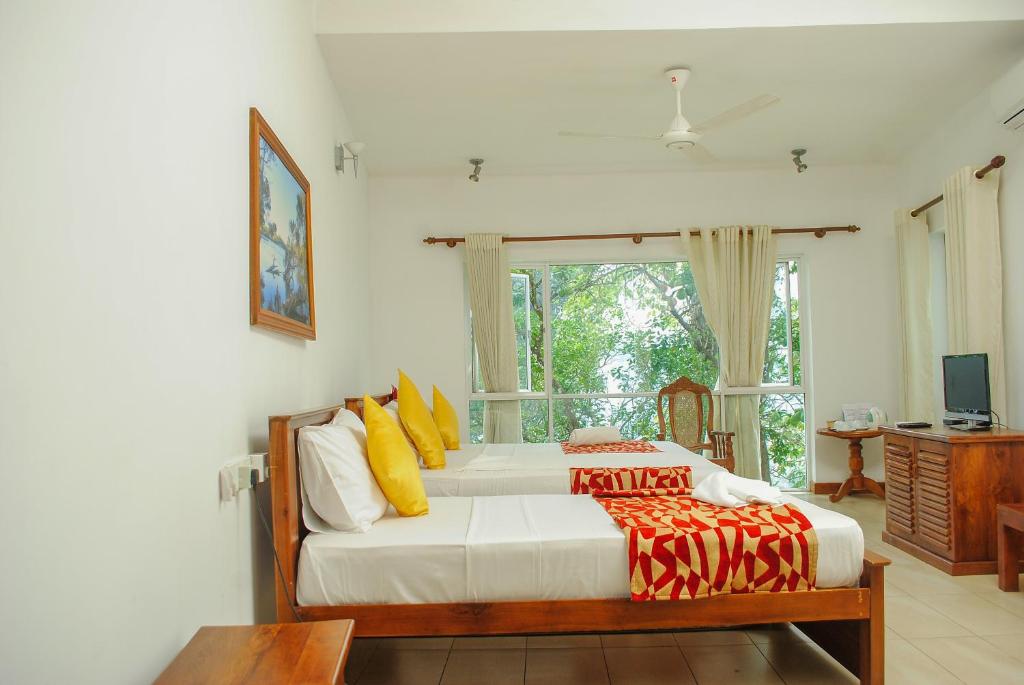 Letto o letti in una camera di Hotel See Kandy
