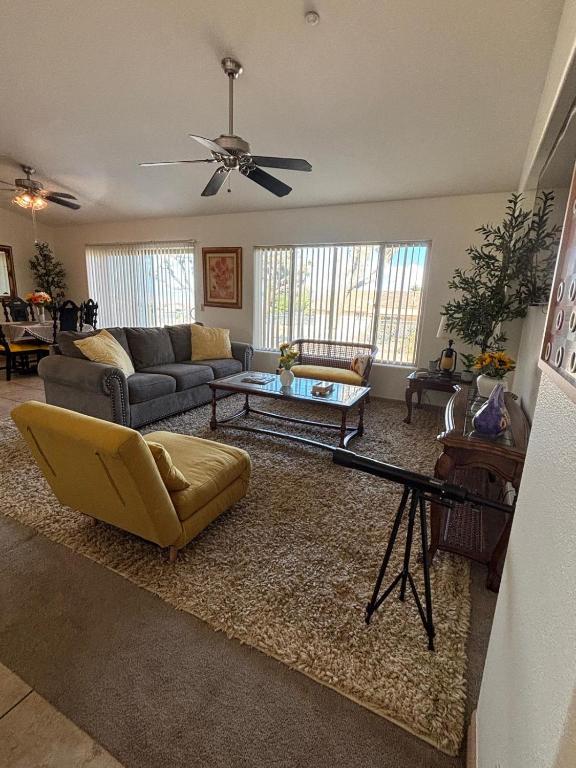 a living room with a couch and a table at New Lux Sunflower House in Joshua Tree