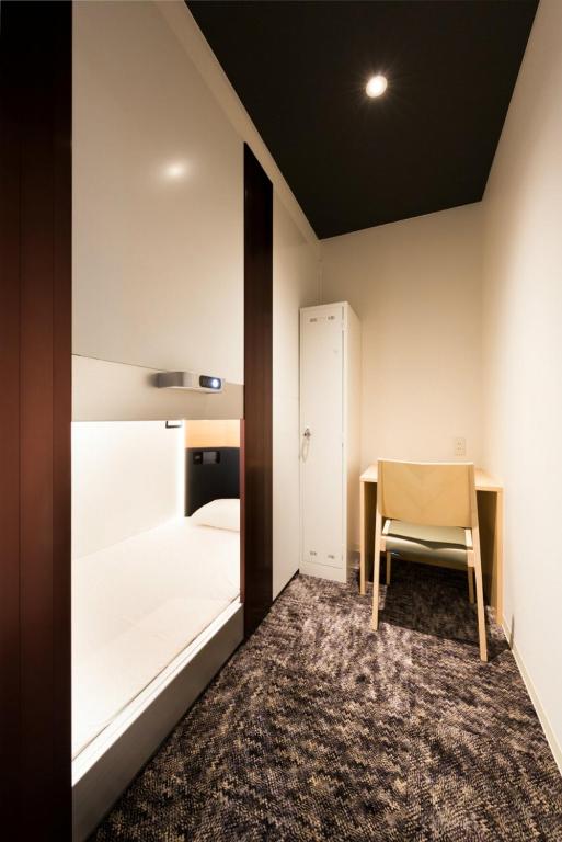 Postel nebo postele na pokoji v ubytování Hotel M Matsumoto