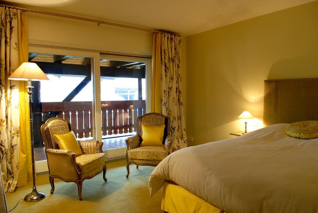 Postel nebo postele na pokoji v ubytování Hôtel à la Ferme