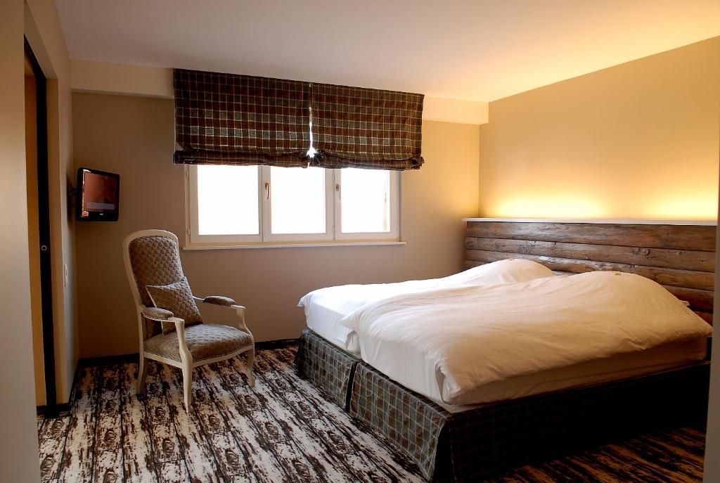 Postel nebo postele na pokoji v ubytování Hôtel à la Ferme