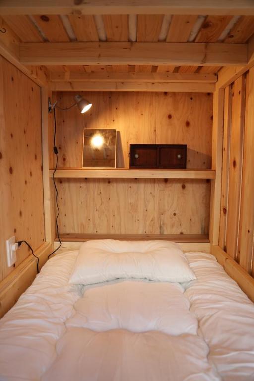 Postel nebo postele na pokoji v ubytování Kagaribi Guesthouse