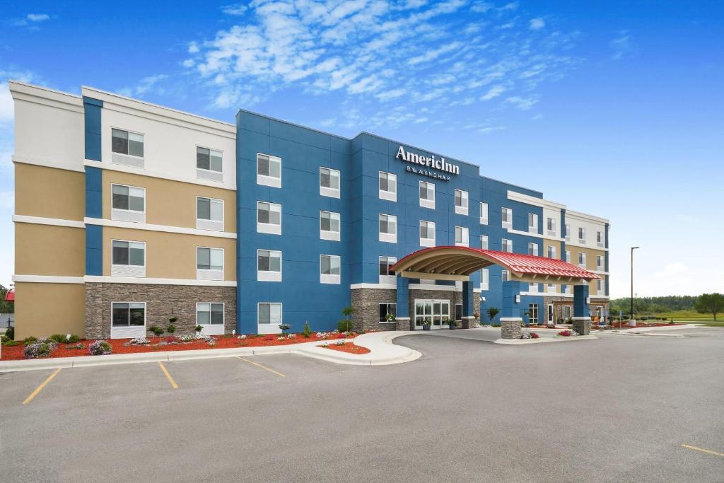 a hotel with a parking lot in front of it at AmericInn by Wyndham International Falls in International Falls