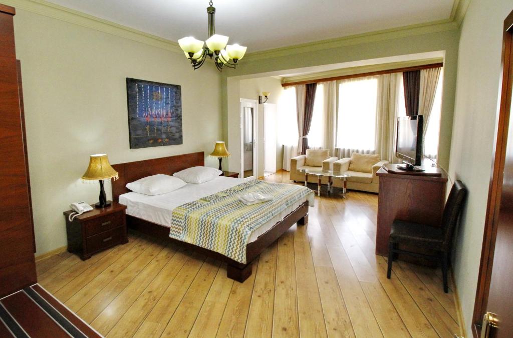 Postel nebo postele na pokoji v ubytování Penthouse Hotel