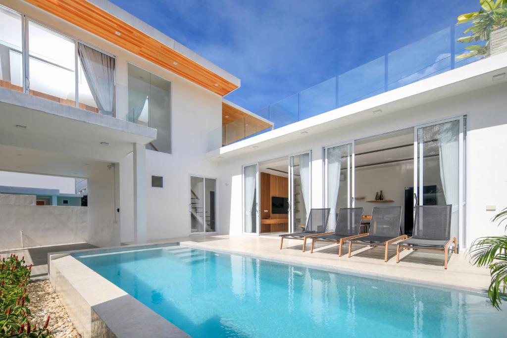 a swimming pool in the backyard of a house at Luxury Tropical Villa Samui - Shira in Koh Samui 