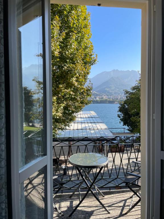 a view of a lake from a window at La finestra sul lago in Malgrate