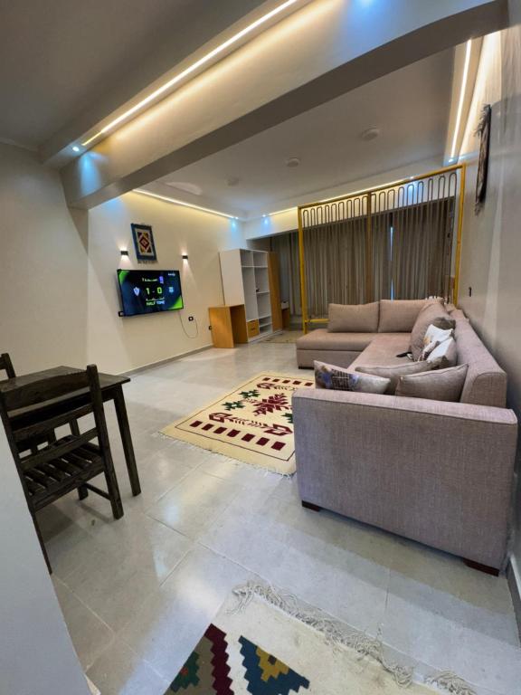 a large living room with a couch and a table at Omars shalet in Dahab