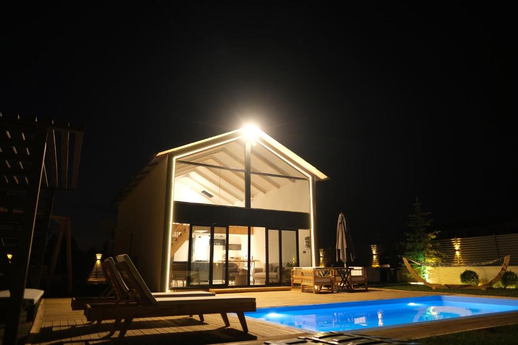 a house with a light on top of it at night at Terra Viva Villa's in Erenköy