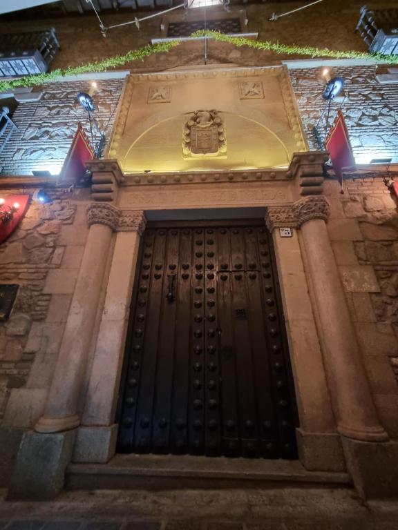 a front door of a building with lights on it at Hotel Boutique Casón De Los López in Toledo