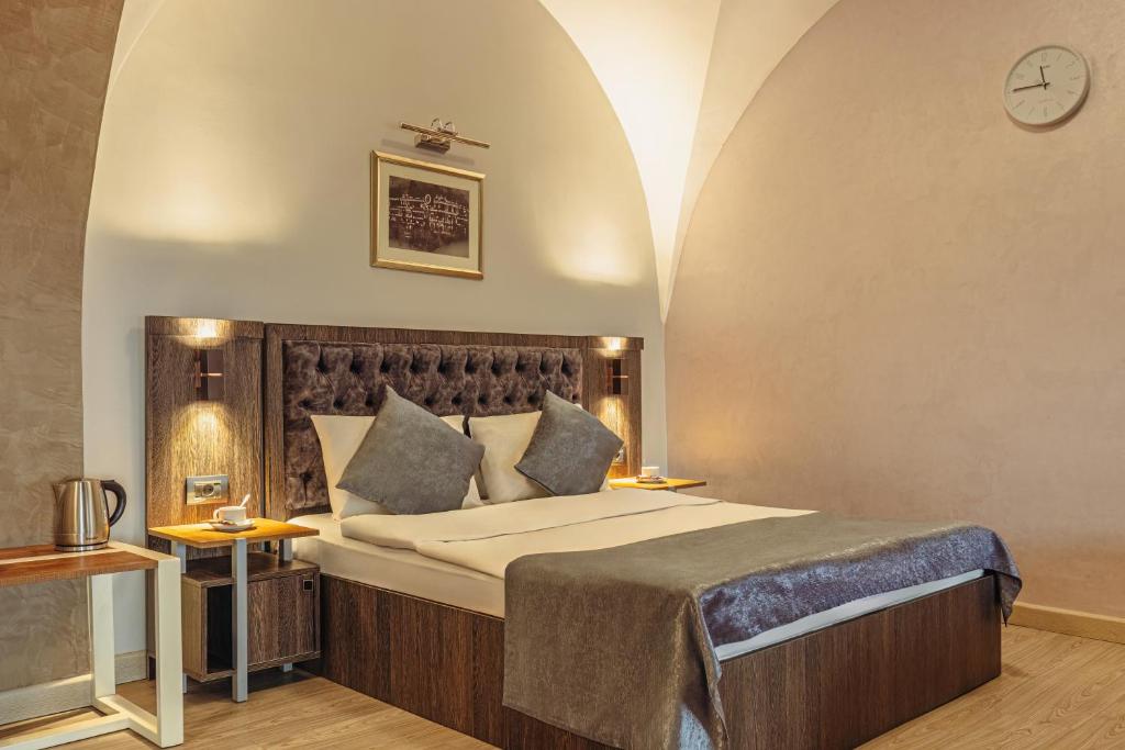 a bedroom with a large bed in a room at Ronni Hotel in Baku