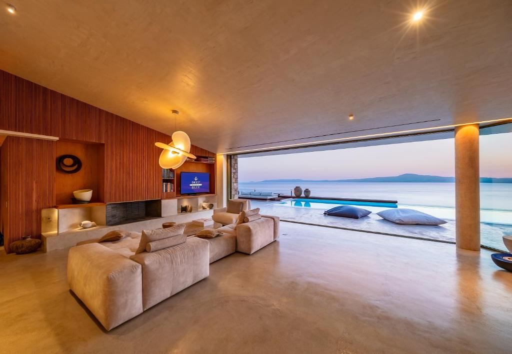 a living room with a view of the ocean at Villa Deep Blue in Messinia in Verga Kalamata