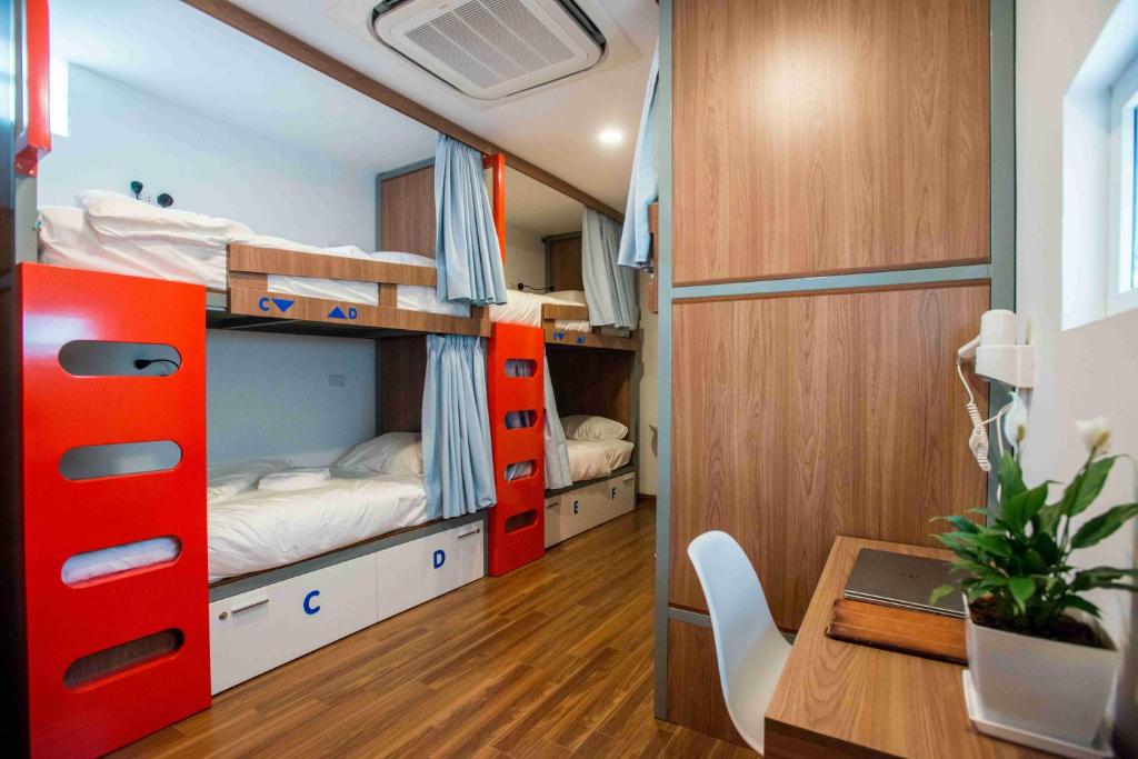 Postel nebo postele na pokoji v ubytování Nexy Hostel