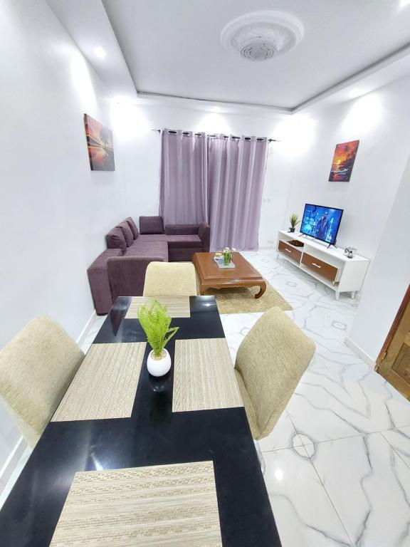 a living room with a couch and a table at Saphir in Dakar