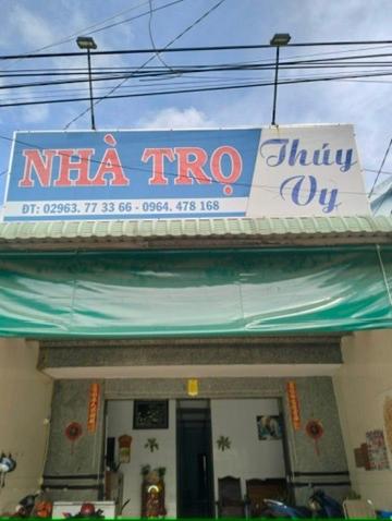 a sign on top of a nita trigo building at Nhà Trọ Thuý Vy in Tri Tôn