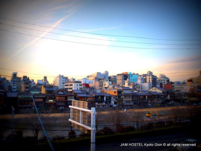 a view of a city with buildings in the background at JAM Hostel Kyoto Gion in Kyoto