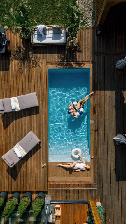 an overhead view of a woman swimming in a pool at Chata Dwie Doliny in Muszyna