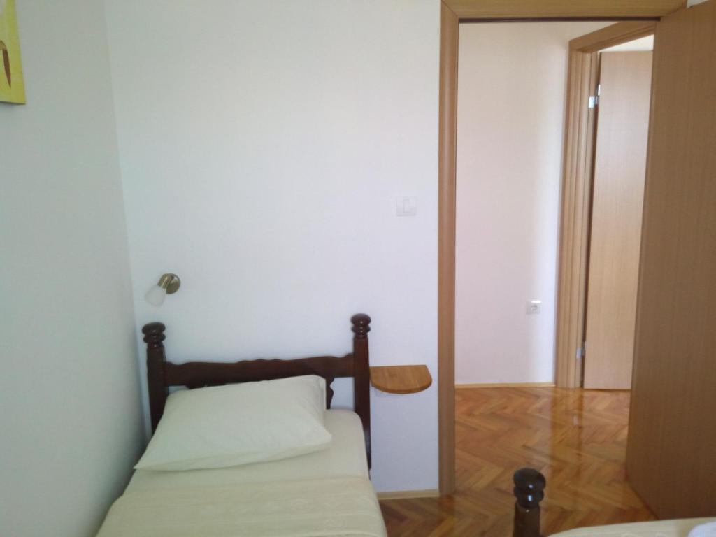 Postel nebo postele na pokoji v ubytování Sun Apartments