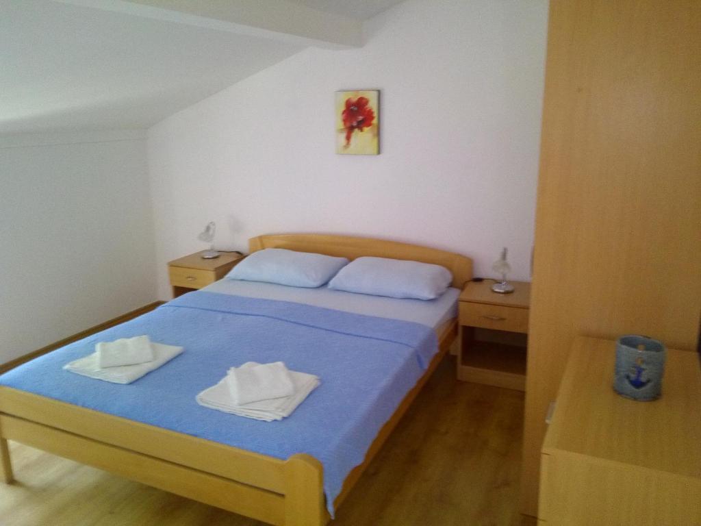 Postel nebo postele na pokoji v ubytování Sun Apartments