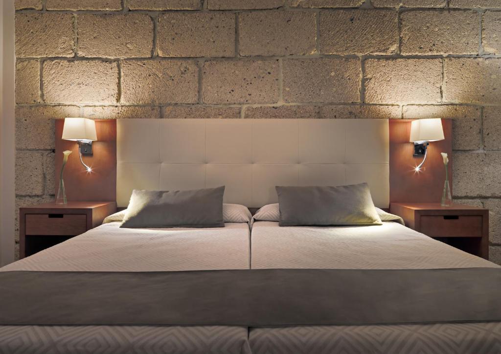 Posteľ alebo postele v izbe v ubytovaní Hotel Rural Finca Salamanca