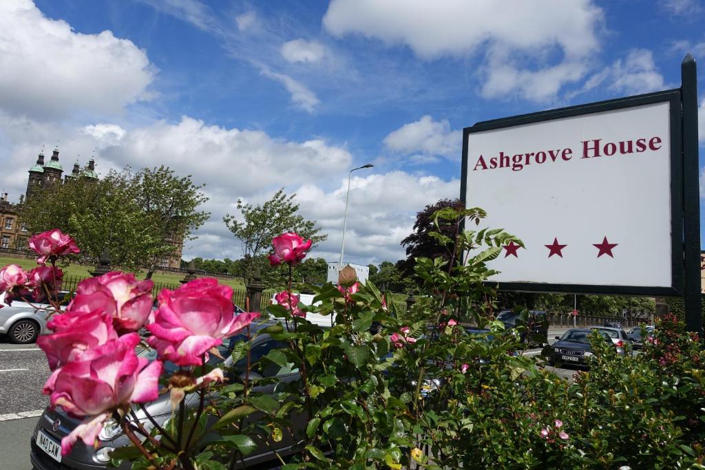 a sign for a alzhero house with pink flowers at Ashgrove House in Edinburgh