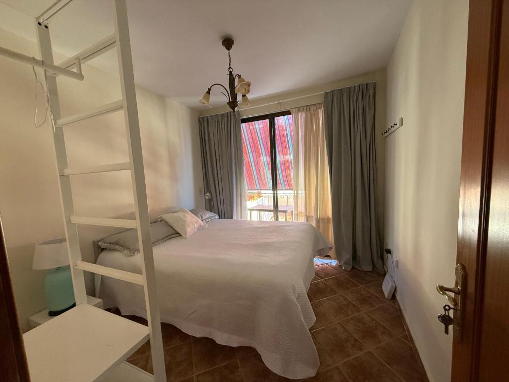 Ένα ή περισσότερα κρεβάτια σε δωμάτιο στο Madre Amada Accommodation Tenerife