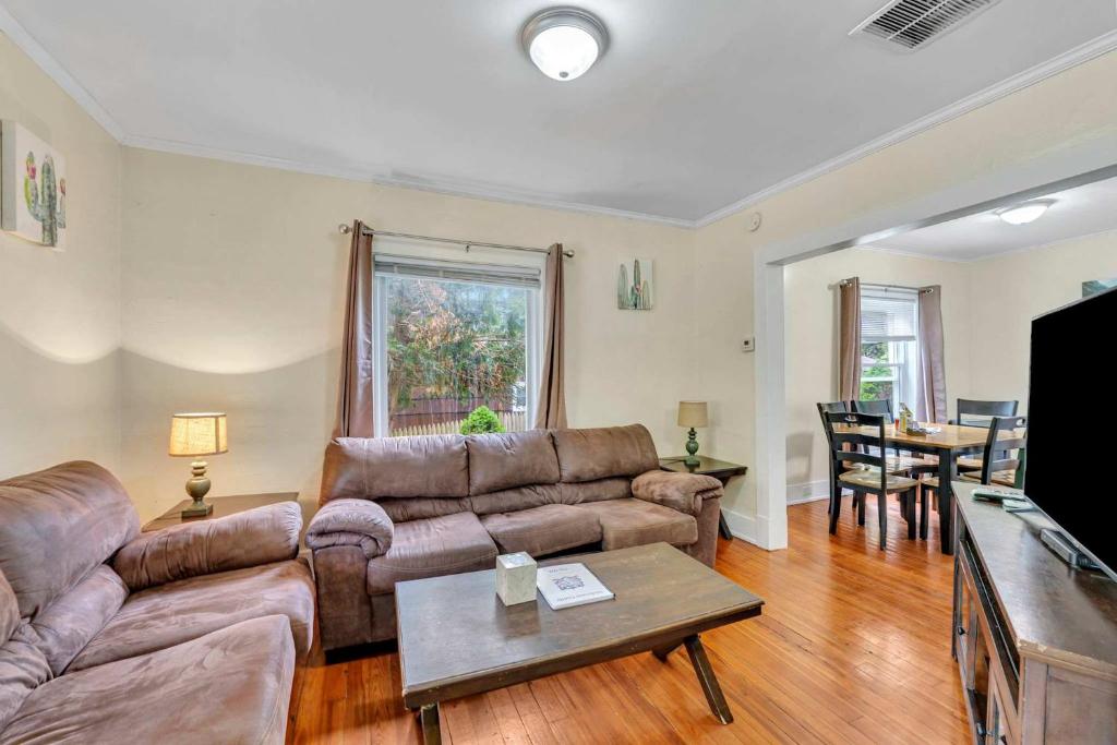 a living room with a couch and a table at The Hill All Star Baseball Rentals in Oneonta
