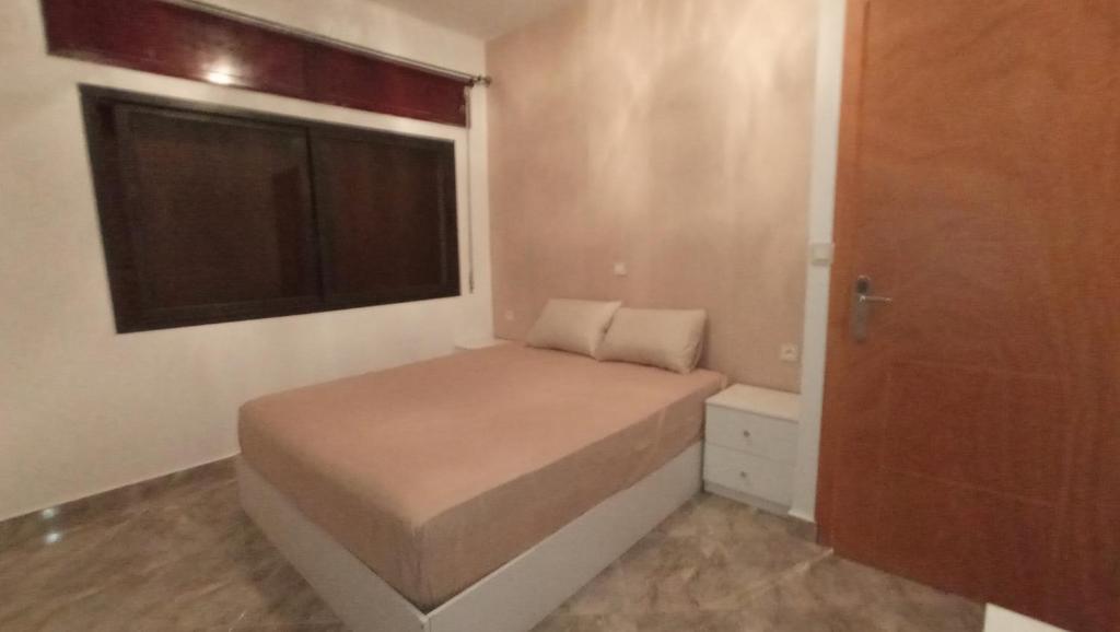 Postel nebo postele na pokoji v ubytování capuchino sanya
